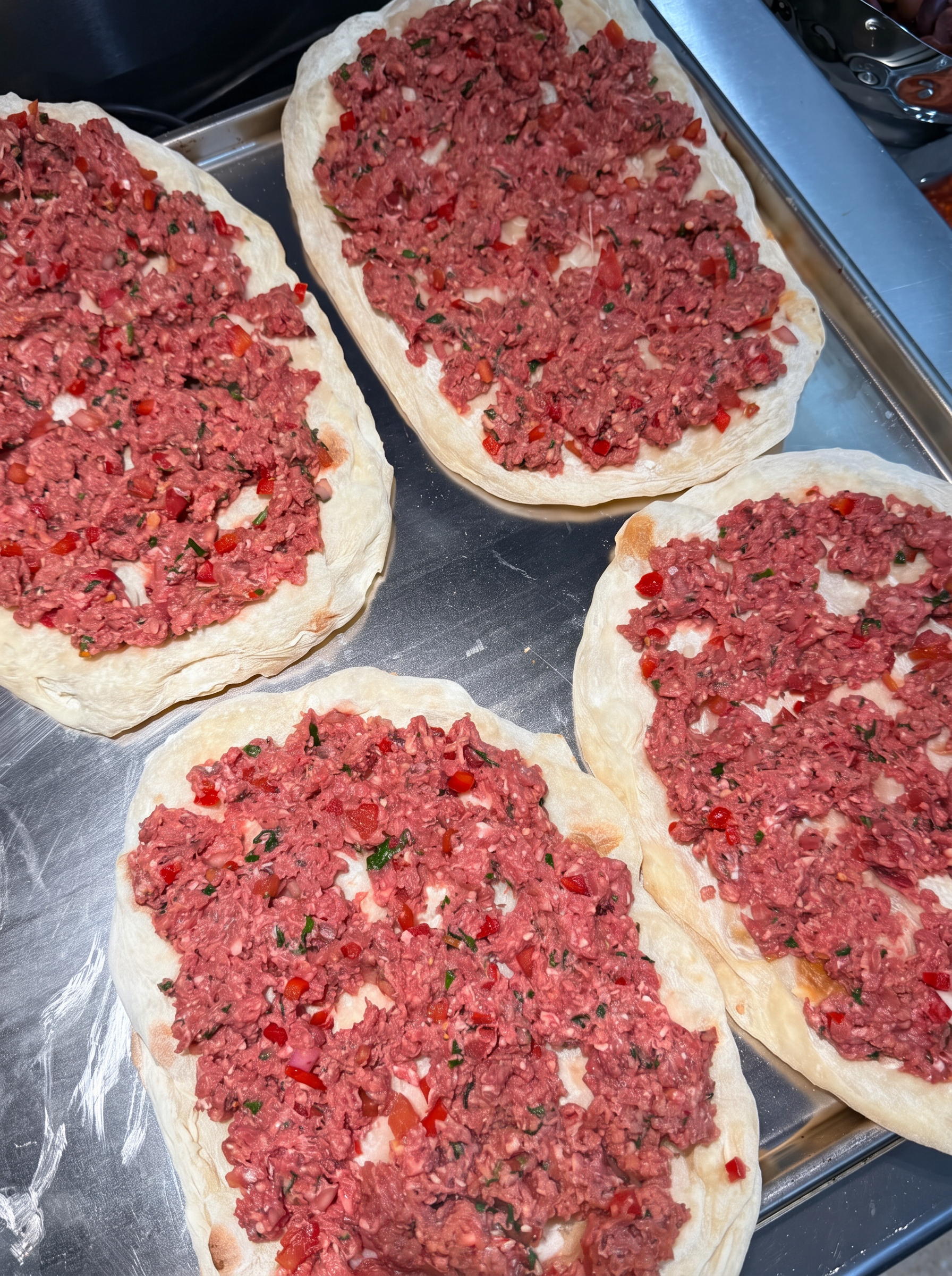 Pinsa Romana bases topped with spiced minced meat